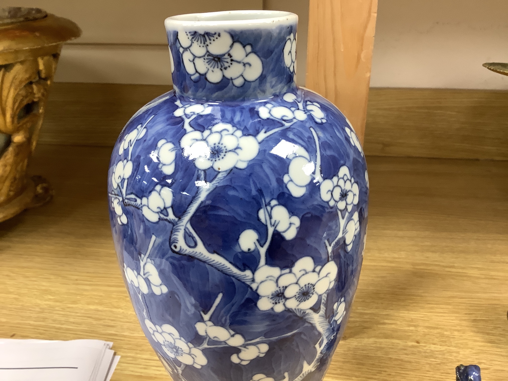 A 19th century Chinese blue and white 'prunus' vase and cover, height 33cm